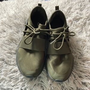 Stylish olive green athletic running shoes